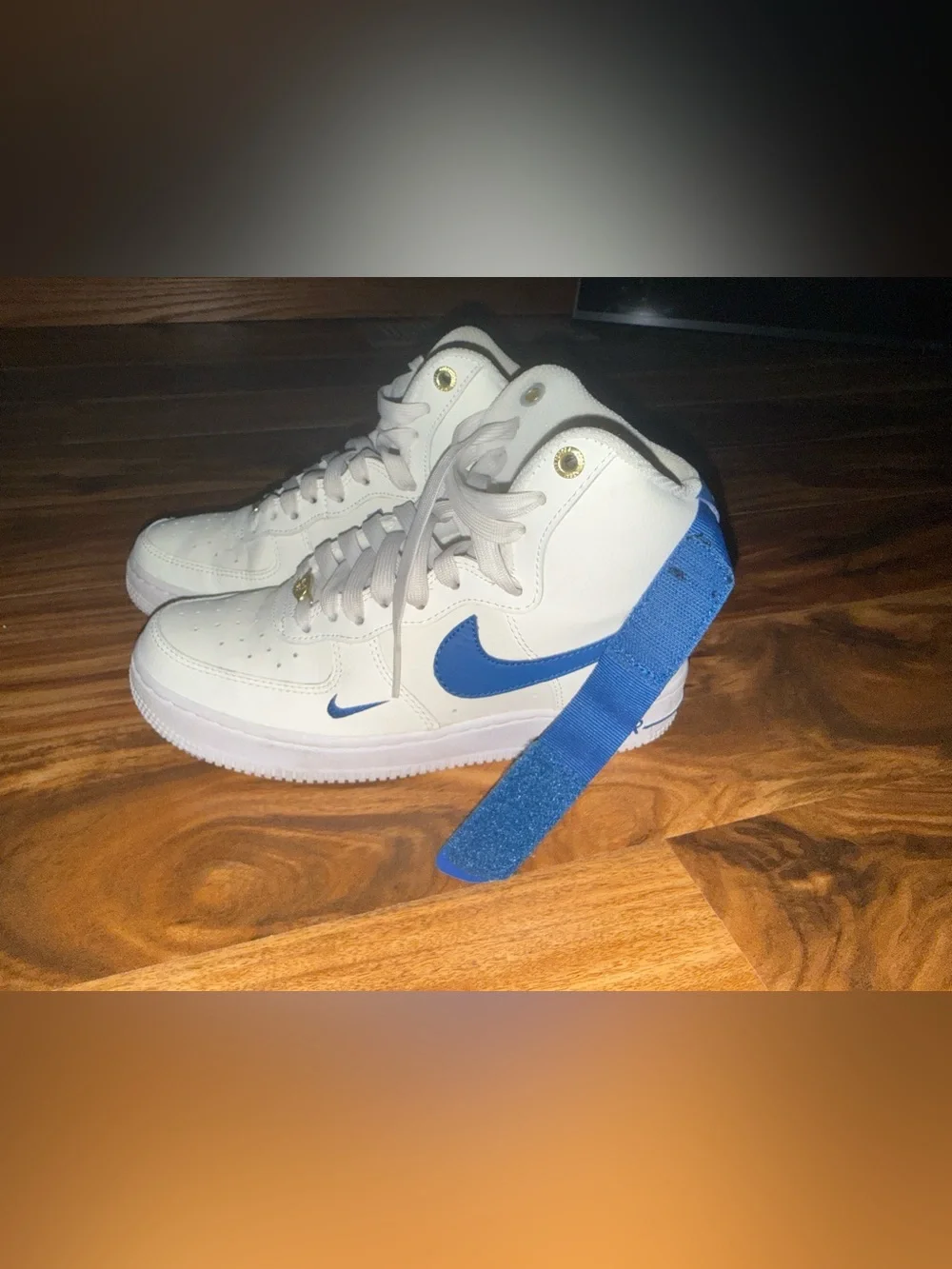 Nike White High-Top Sneakers with Blue Swoosh and Strap